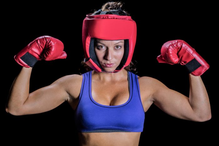 female boxer wearing boxing headgear
